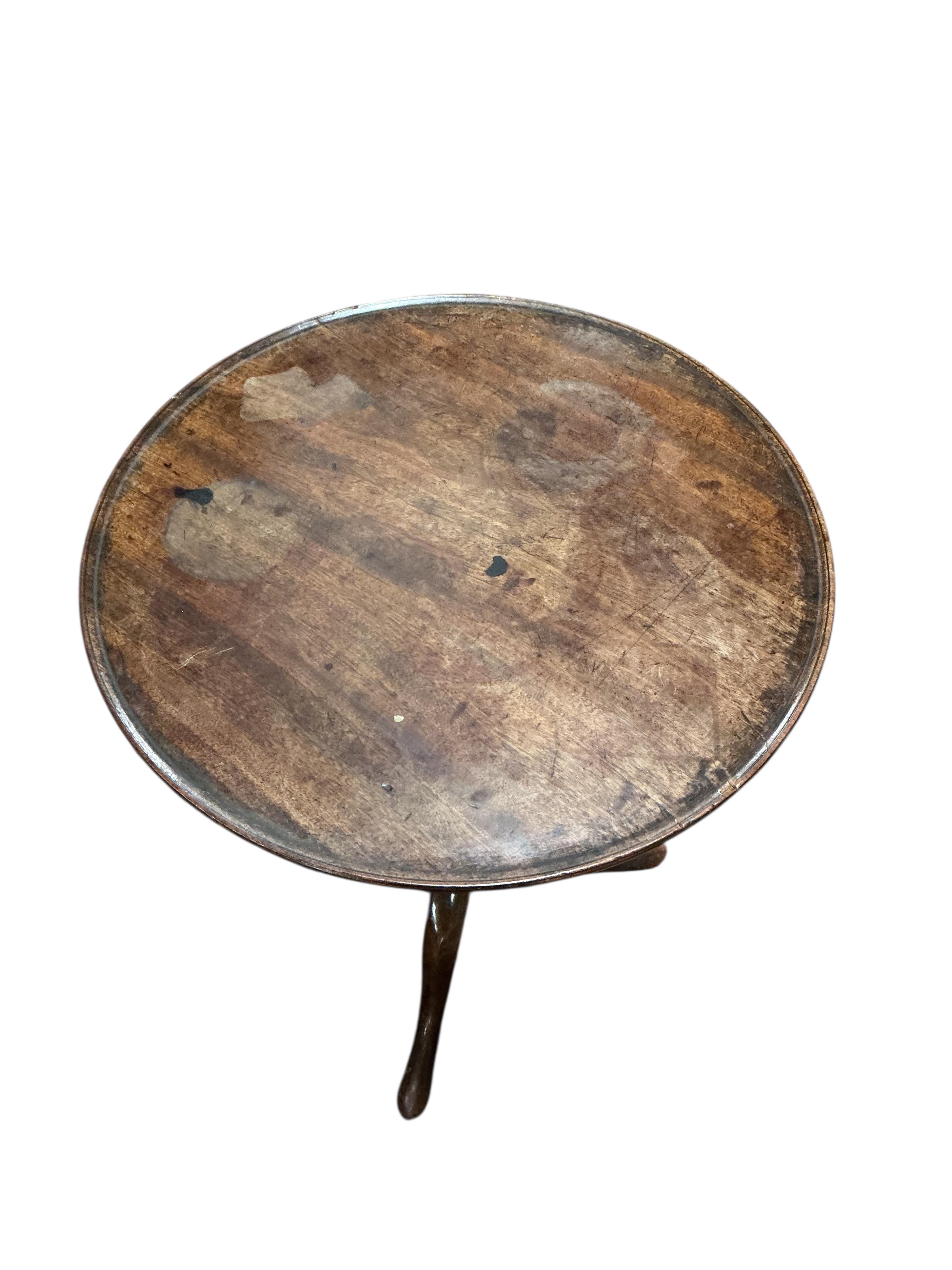 Two early 19th century circular mahogany tripod wine tables, larger diameter 50cm, height 69cm